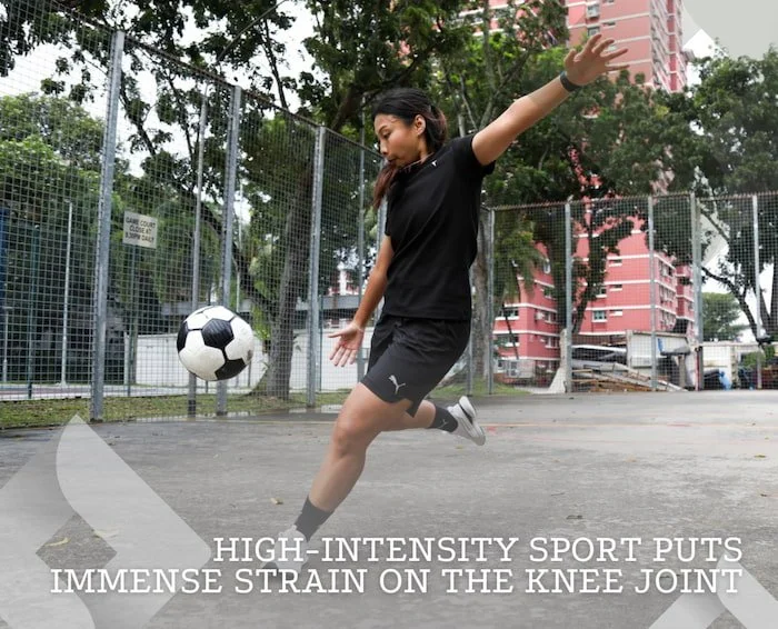 Nadhra Aqilah Footballer kicking soccer ball