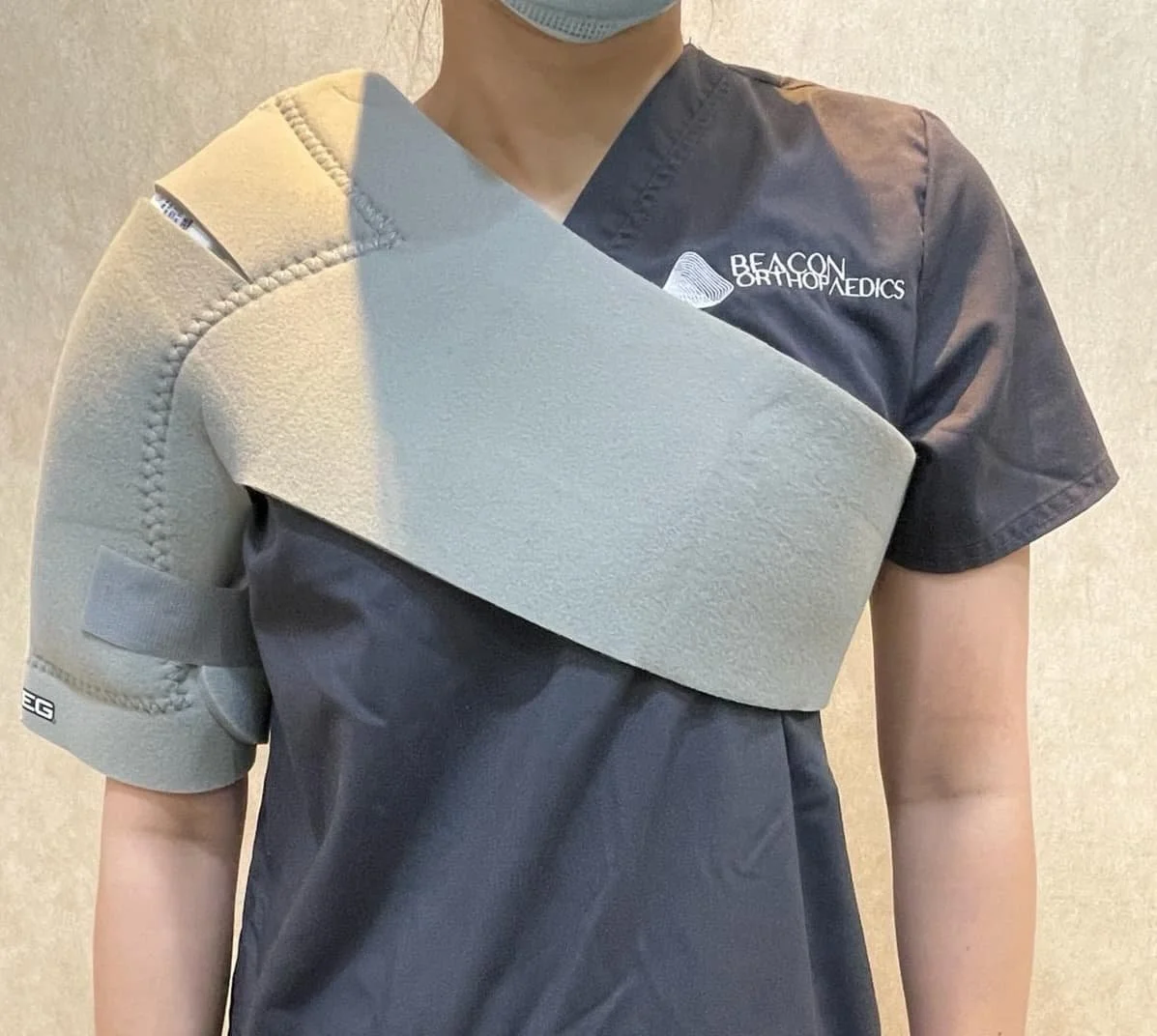 Post-surgery care with cold wrap over the operated shoulder