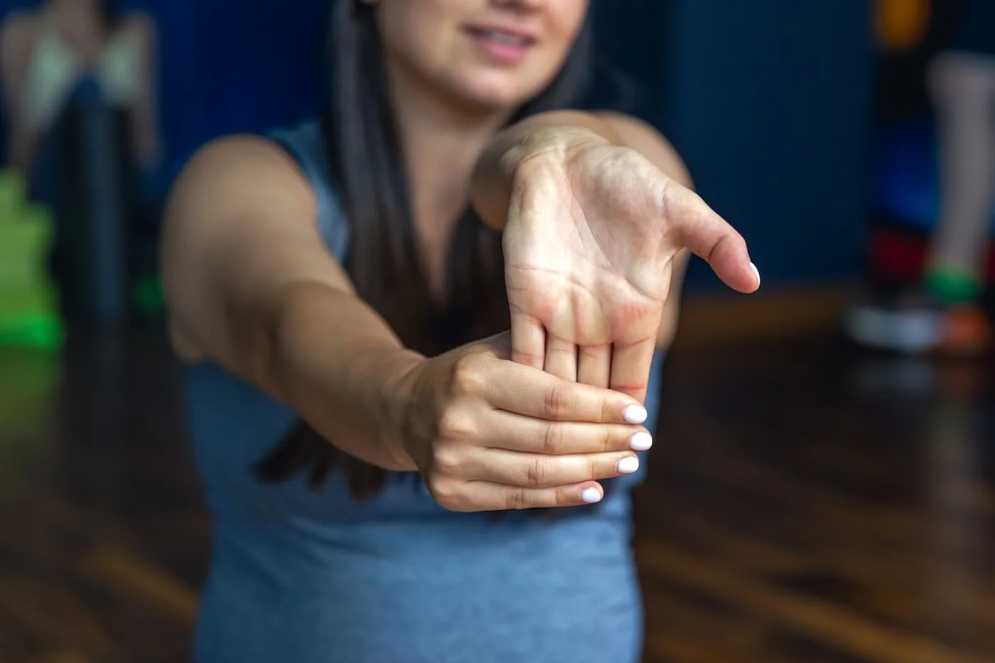 Woman doing wrist flexor stretch